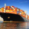 orange black loaded container ship harbour 1950x1463 1