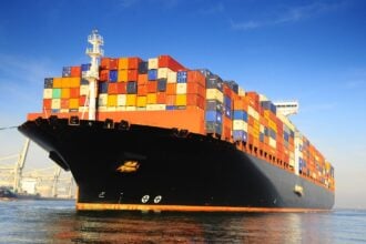 orange black loaded container ship harbour 1950x1463 1