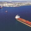 Aerial drone photo of huge crude oil and fuel tanker ship docked in industrial area of Elefsina, Attica, Greece